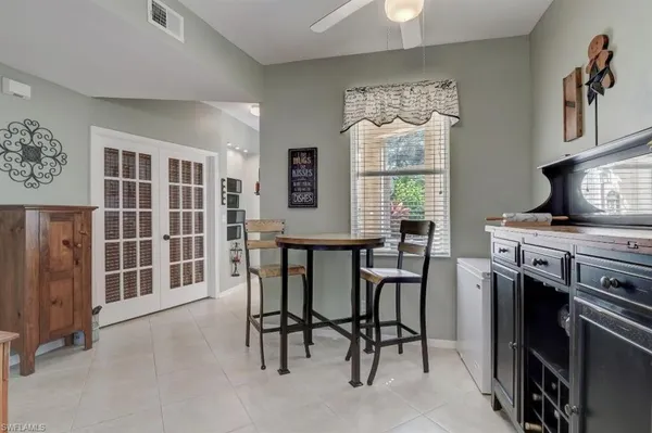 a living room with fireplace furniture and a wooden floor