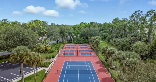 a view of a house with swimming pool and sitting area