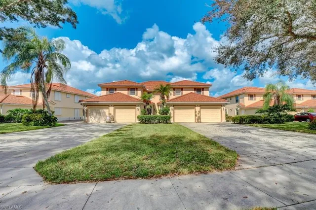 a living room with furniture a chandelier and a flat screen tv