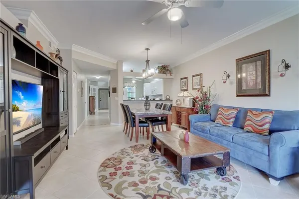 a kitchen with granite countertop a sink a stove and cabinets