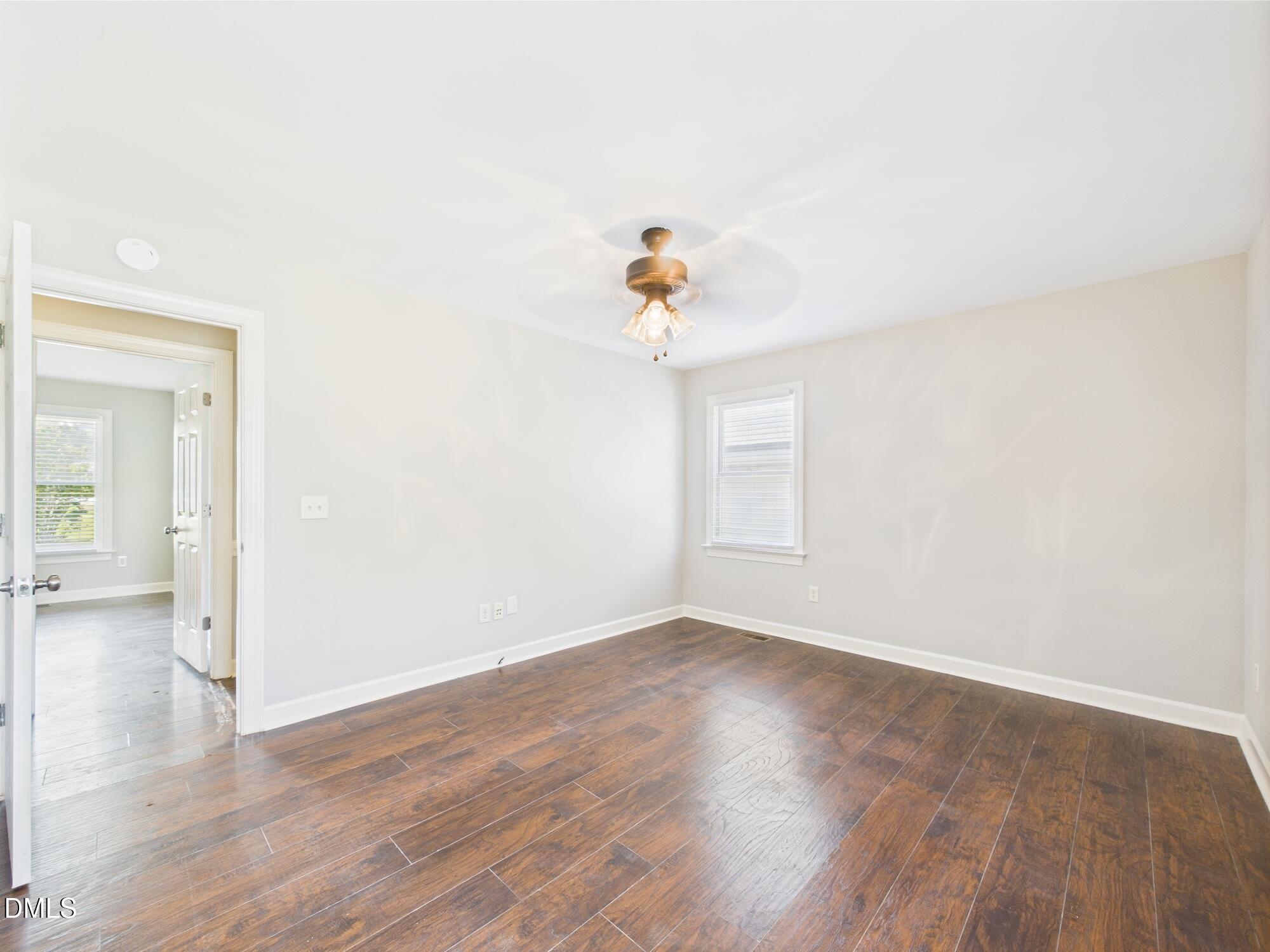 10917 Fanny Brown Road Raleigh, NC 27603 - Photo 28 of 54 wooden floor in an empty room with a window