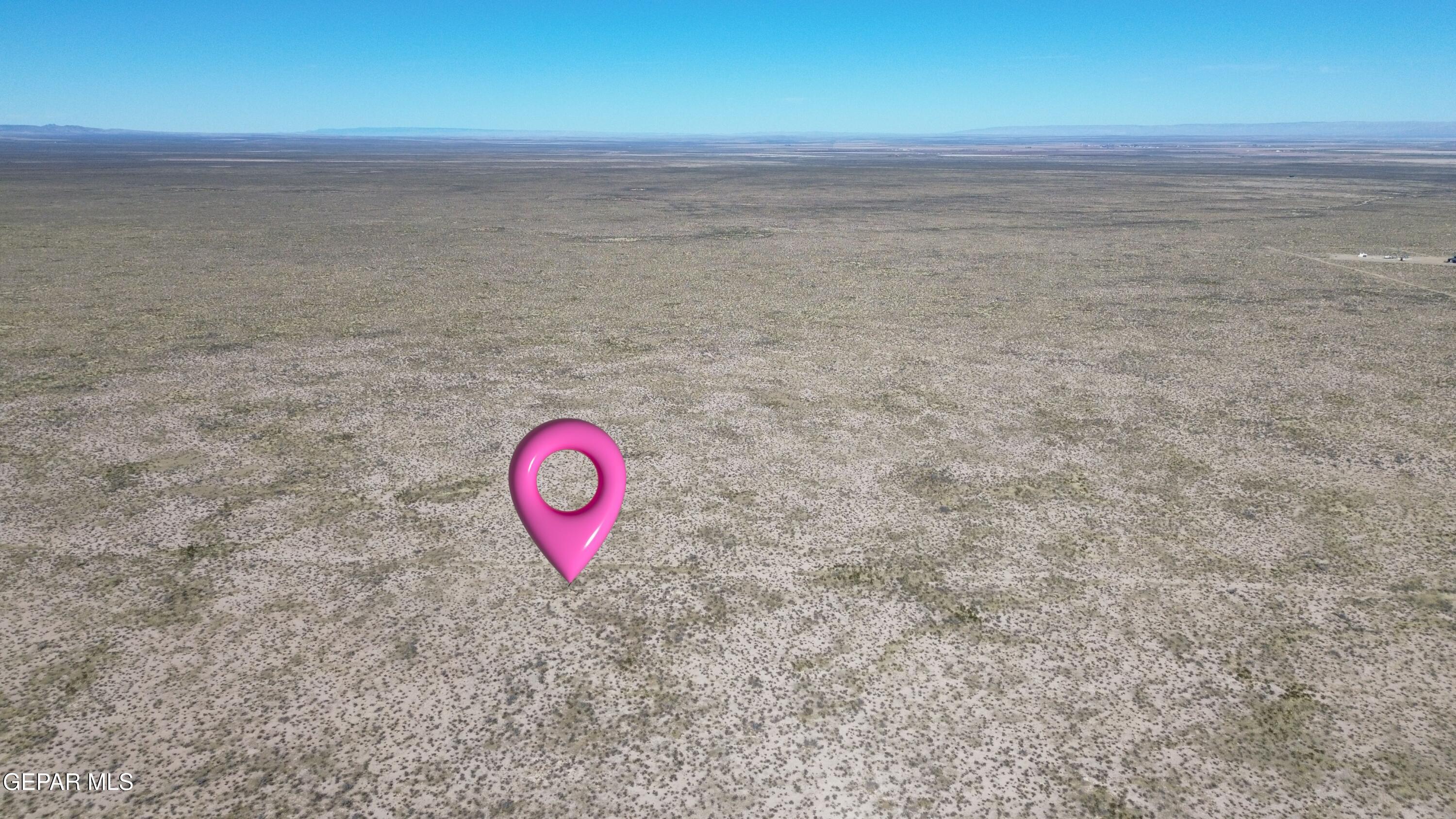 13 Francis Road Dell City, TX 79847 - Photo 6 of 22 a view of a dry yard with wooden floor