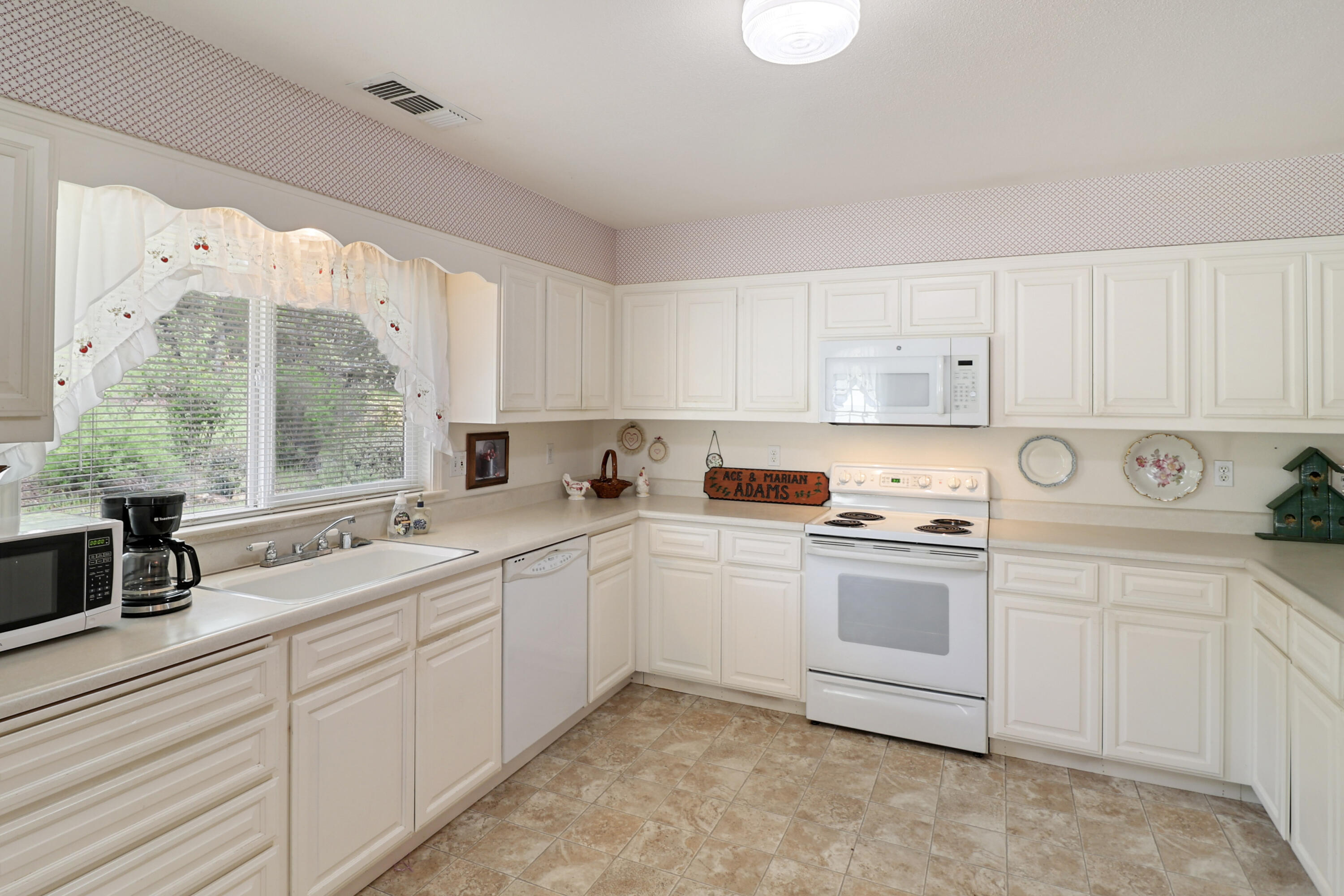 9400 Placer Road Redding, CA 96001 - Photo 12 of 52 a kitchen that has a sink and a stove in it