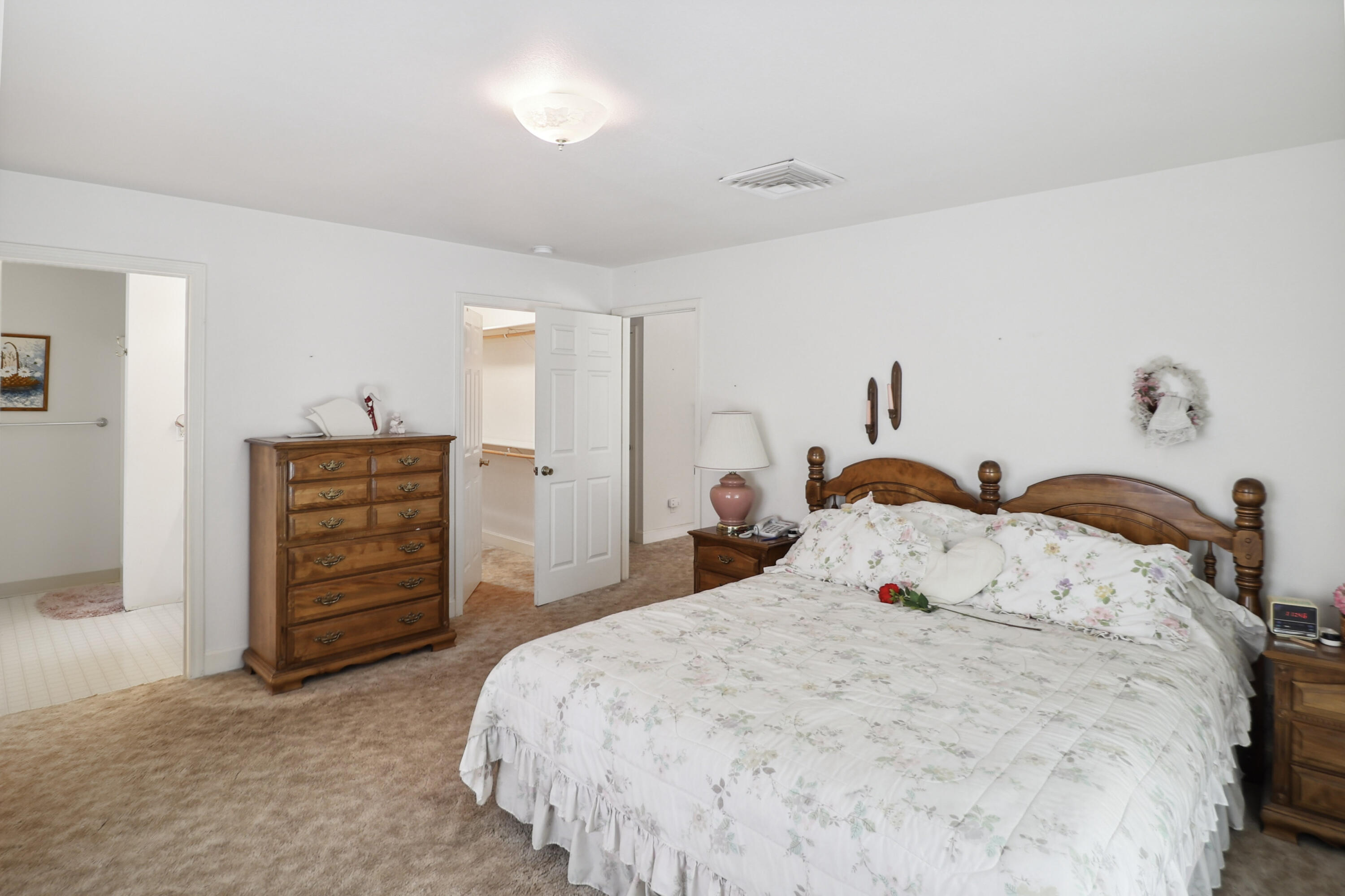 9400 Placer Road Redding, CA 96001 - Photo 23 of 52 a bedroom with a bed and a dresser