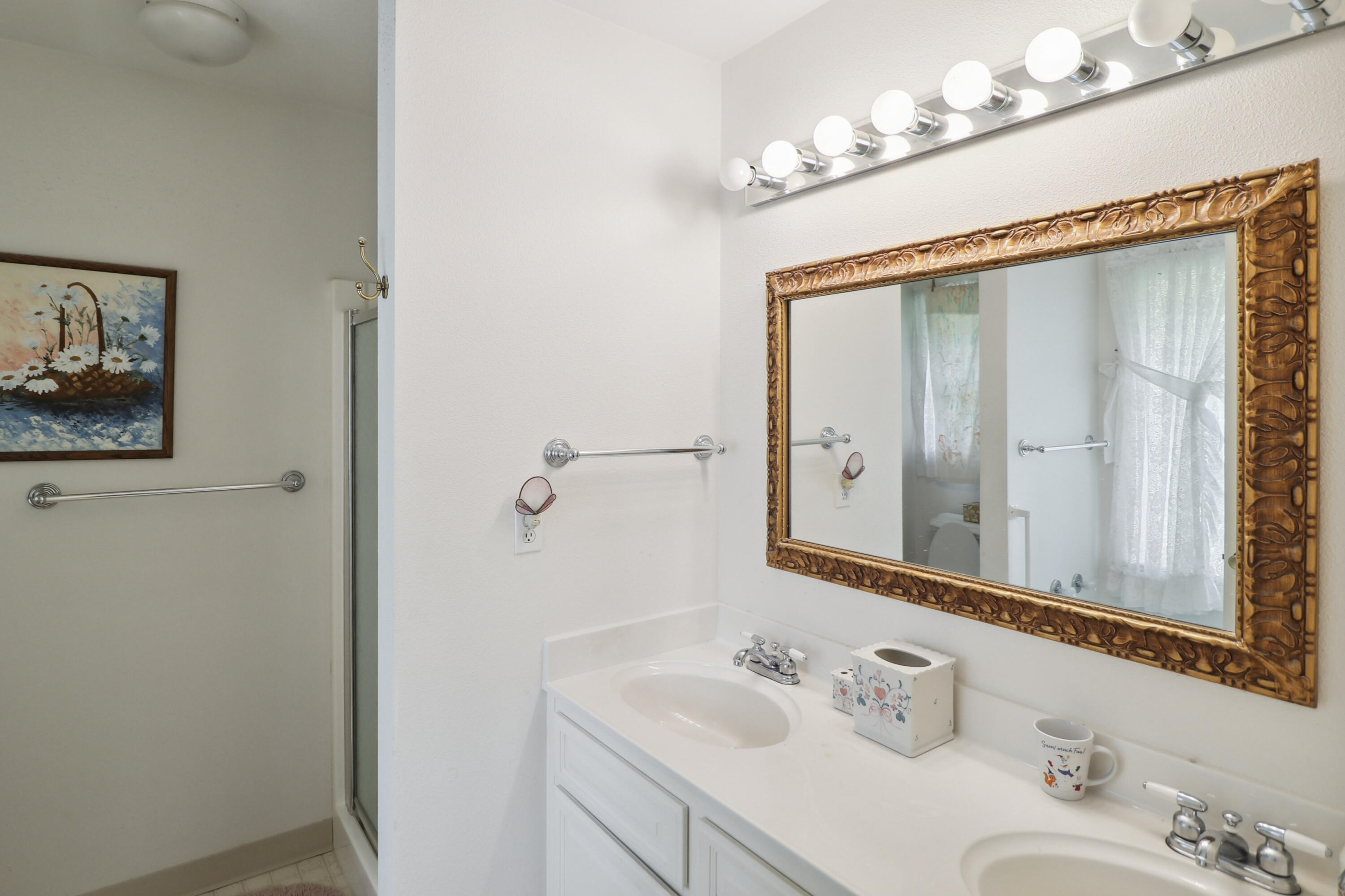 9400 Placer Road Redding, CA 96001 - Photo 25 of 52 a bathroom with a sink and a mirror