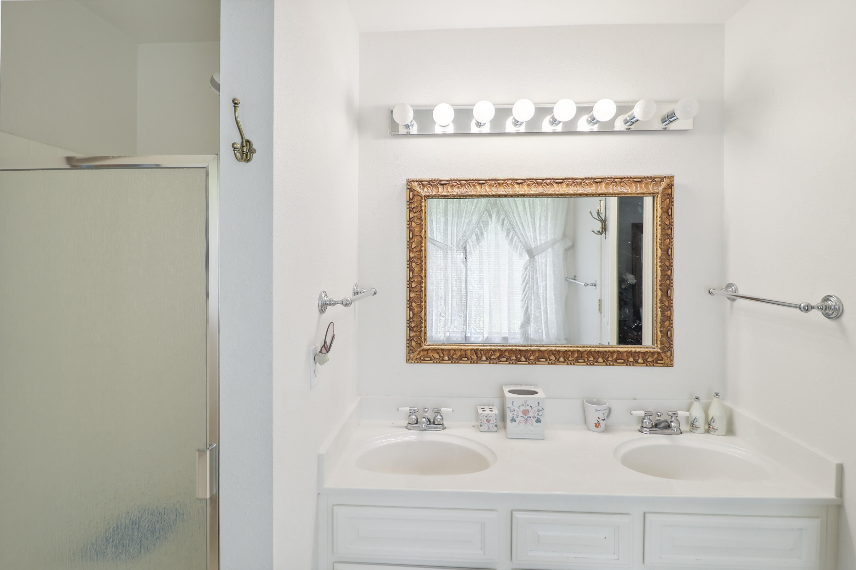 9400 Placer Road Redding, CA 96001 - Photo 27 of 52 a bathroom with a mirror and a sink
