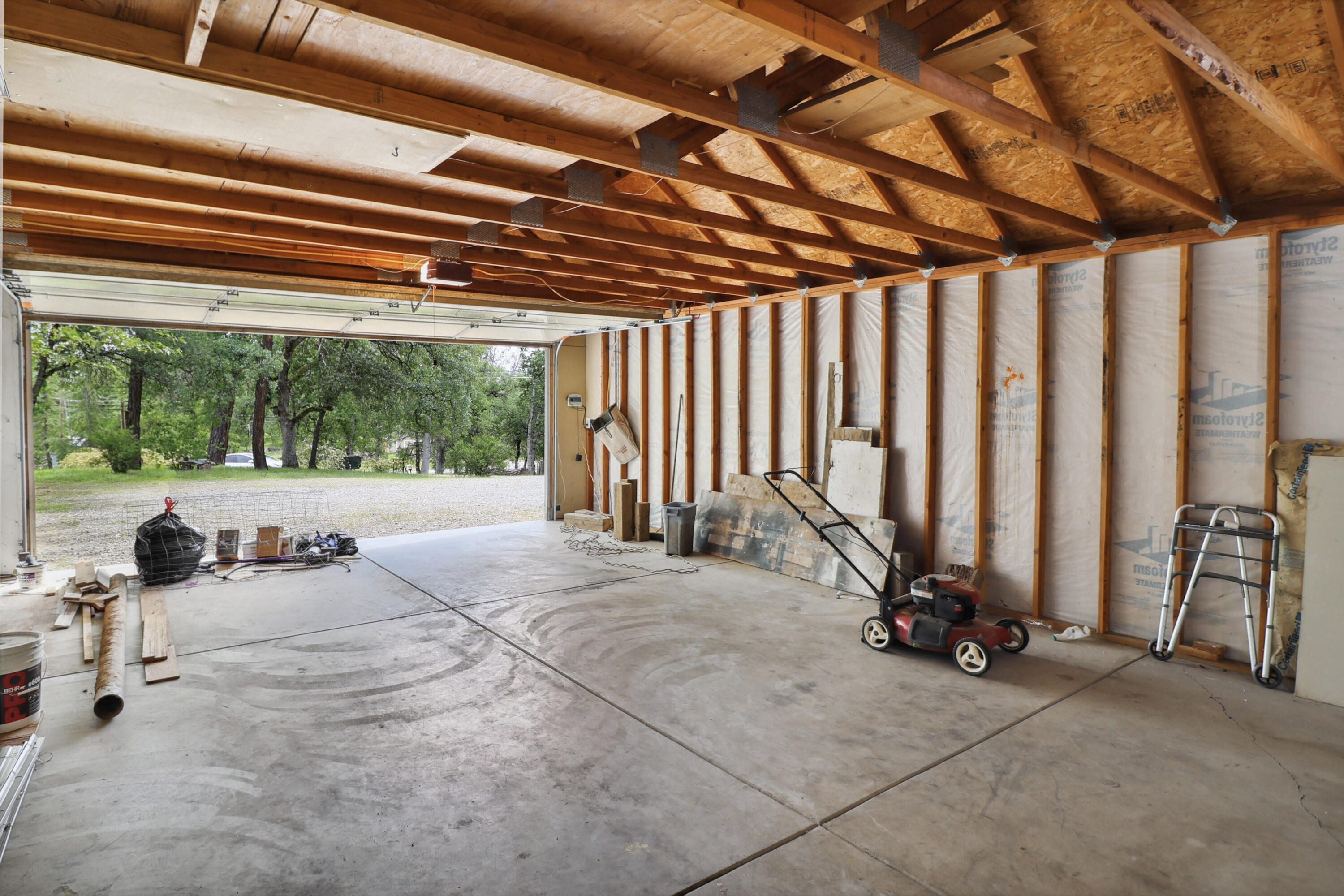 9400 Placer Road Redding, CA 96001 - Photo 29 of 52 a view of a room with gym equipment and a large tree