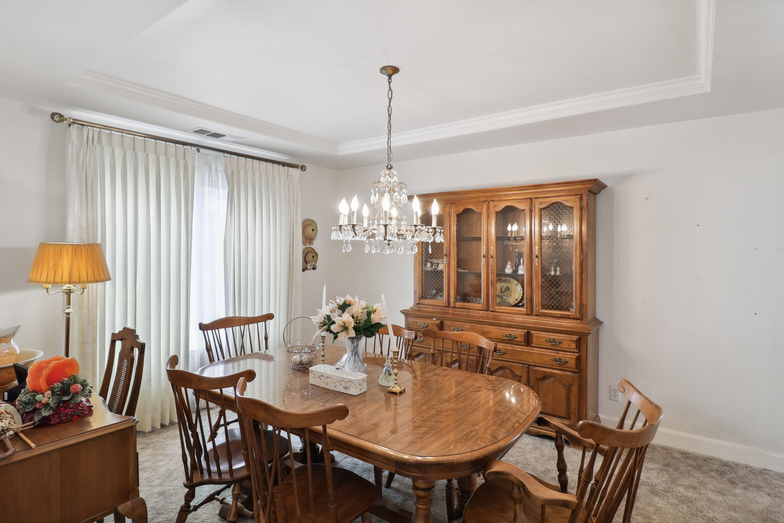 9400 Placer Road Redding, CA 96001 - Photo 3 of 52 a view of a dining room with furniture and chandelier