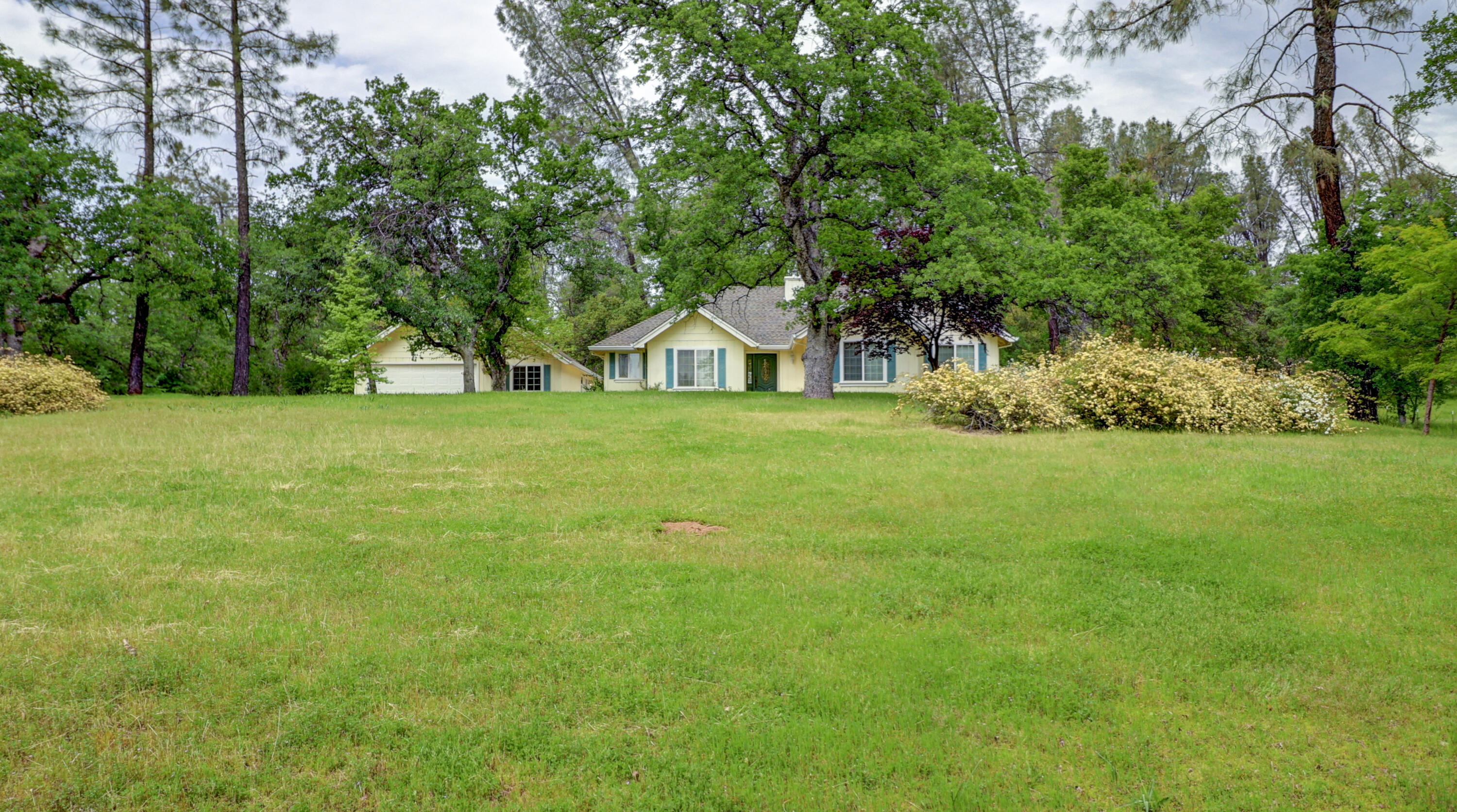 9400 Placer Road Redding, CA 96001 - Photo 39 of 52 a front view of a house with a yard