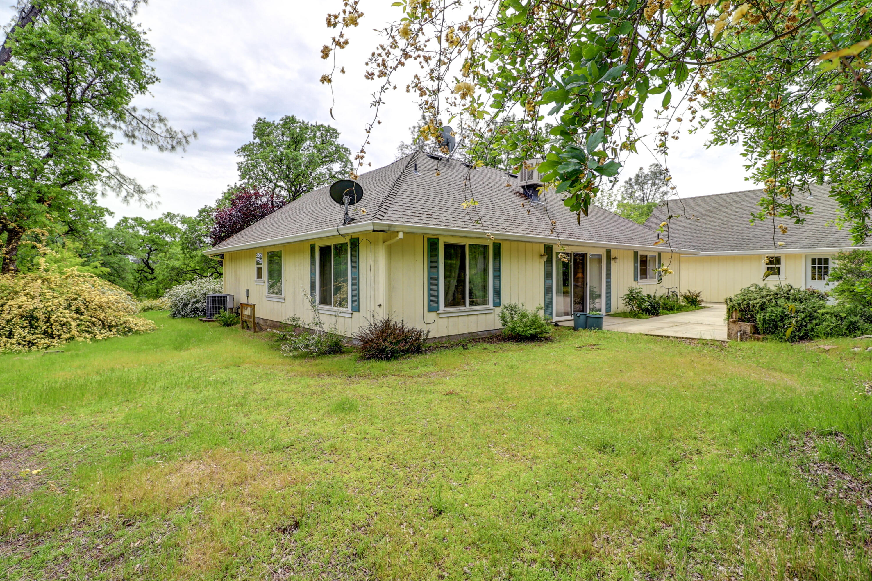 9400 Placer Road Redding, CA 96001 - Photo 48 of 52 a front view of a house with garden