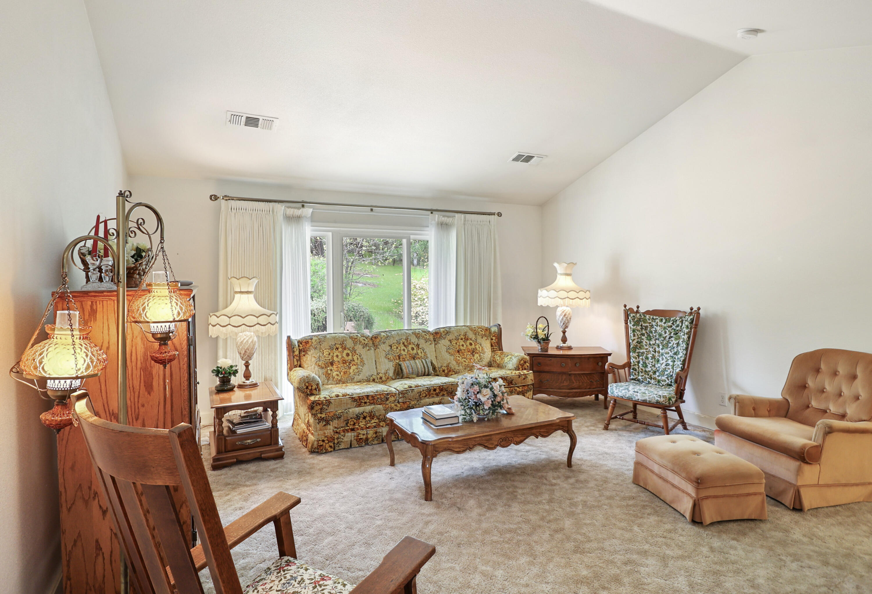 9400 Placer Road Redding, CA 96001 - Photo 6 of 52 a living room with furniture fireplace and a large window