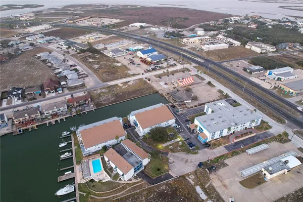 an aerial view of residential houses with outdoor space