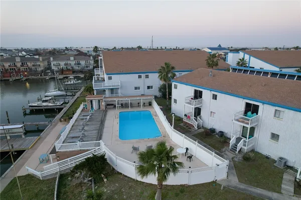 an aerial view of a house with a ocean view