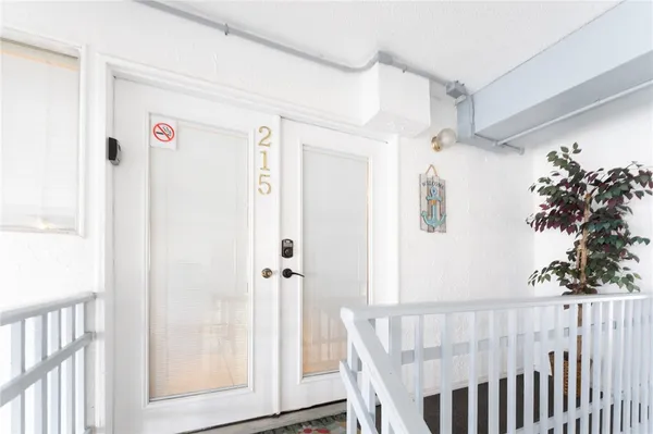 a view of a hallway with a white walls