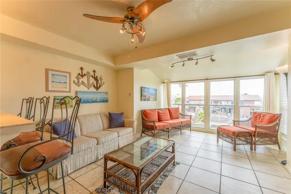 a living room with furniture and a large window