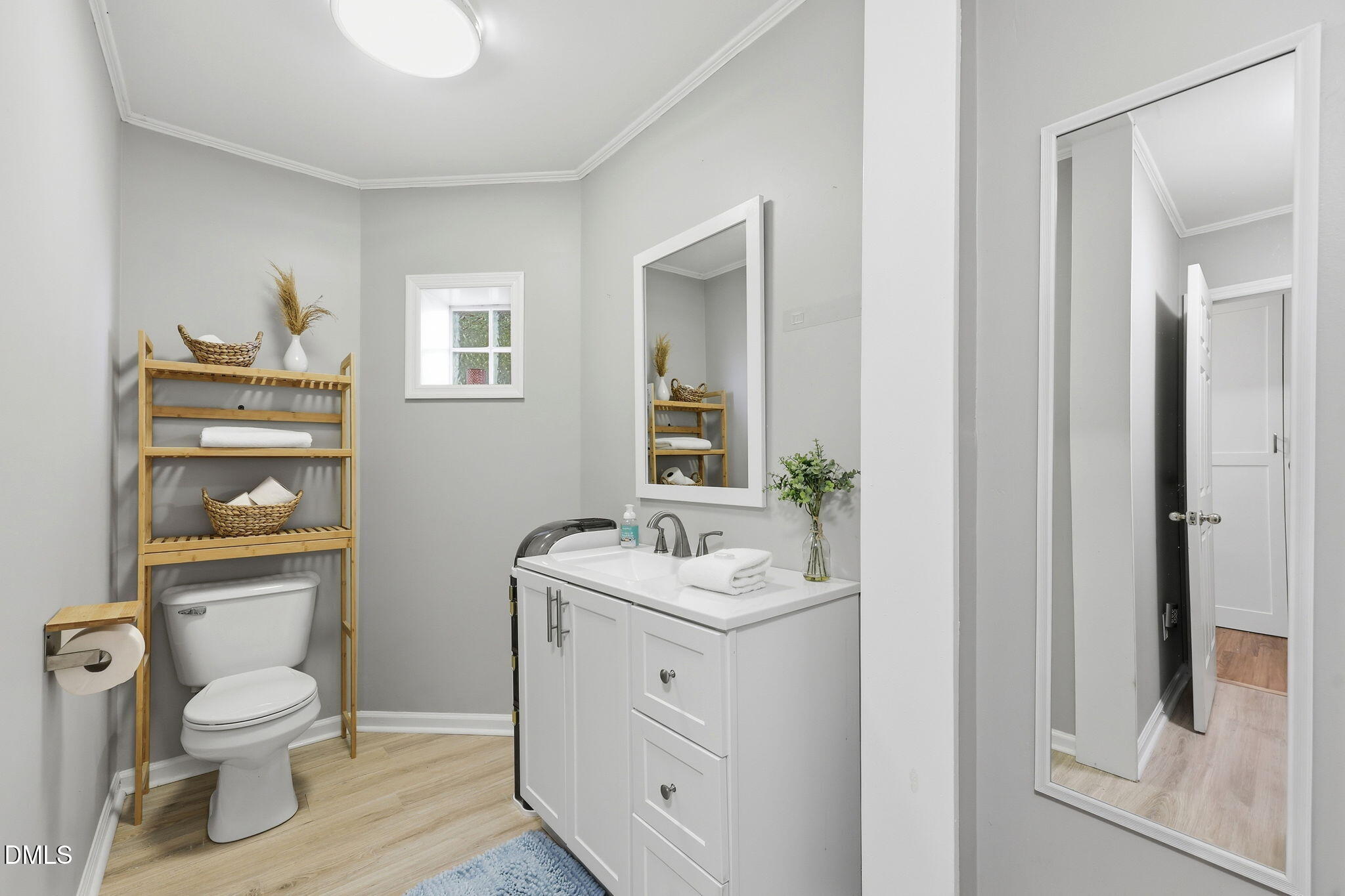 174 Windy Point Road Beaufort, NC 28516 - Photo 52 of 55 Vanity with storage, window for natural light, convenient for guest use.
