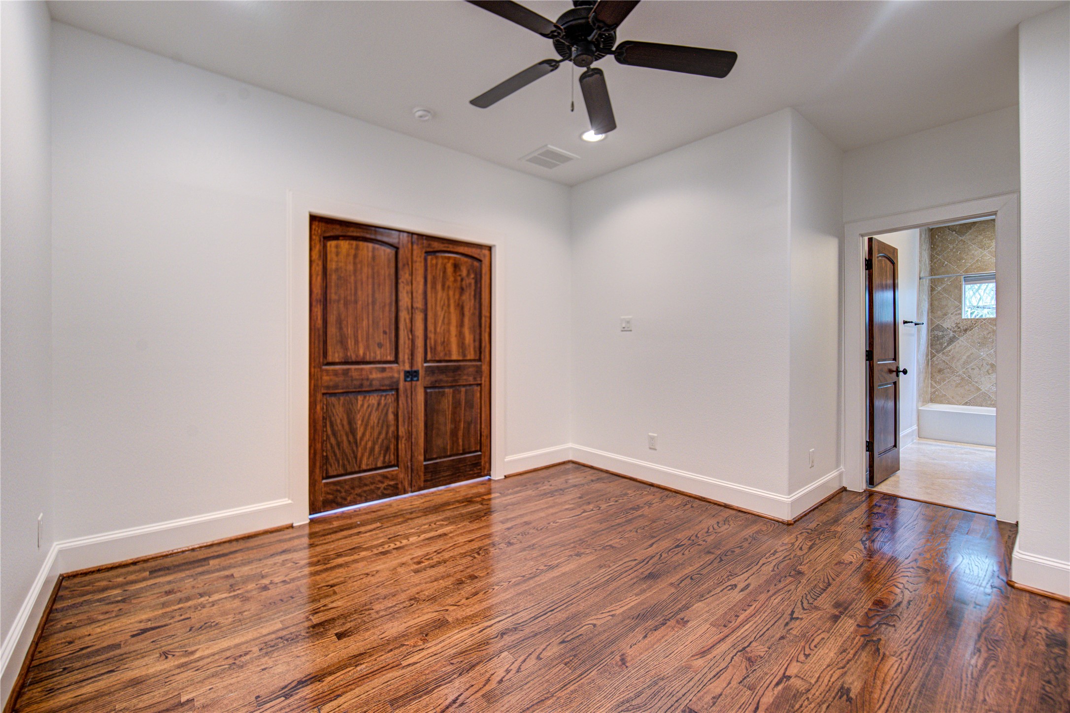 6520 Rodrigo Street Houston, TX 77007 - Photo 26 of 44 Spacious second-floor flex room with hardwood floors and double solid wood doors, designed to adapt to your lifestyle needs