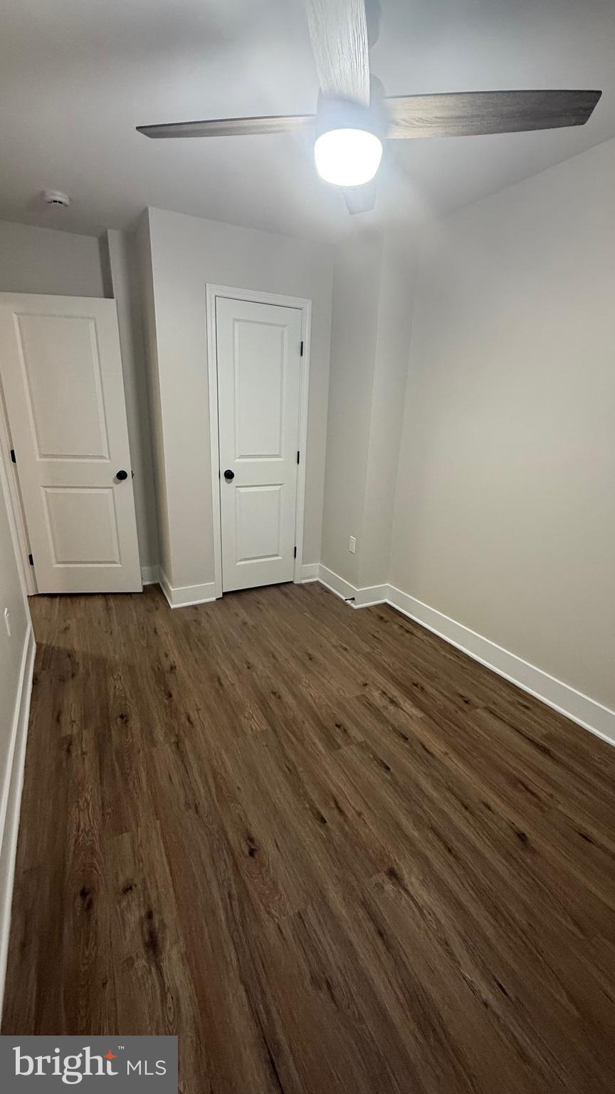 3802 Rokeby Road Baltimore, MD 21229 - Photo 12 of 16 a view of an empty room with wooden floor