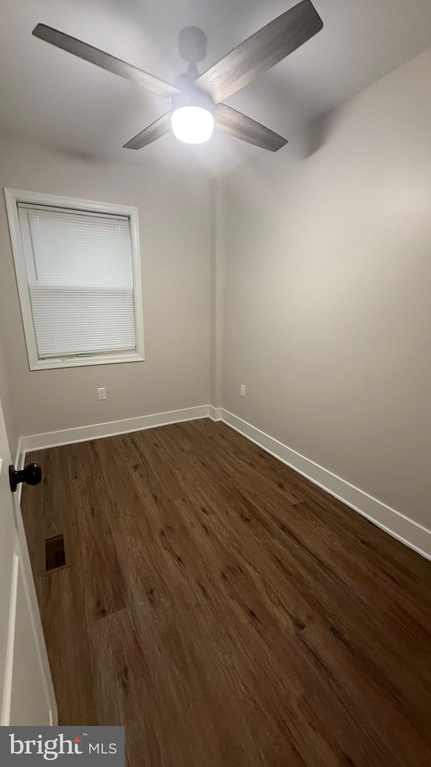 3802 Rokeby Road Baltimore, MD 21229 - Photo 13 of 16 wooden floor in a empty room