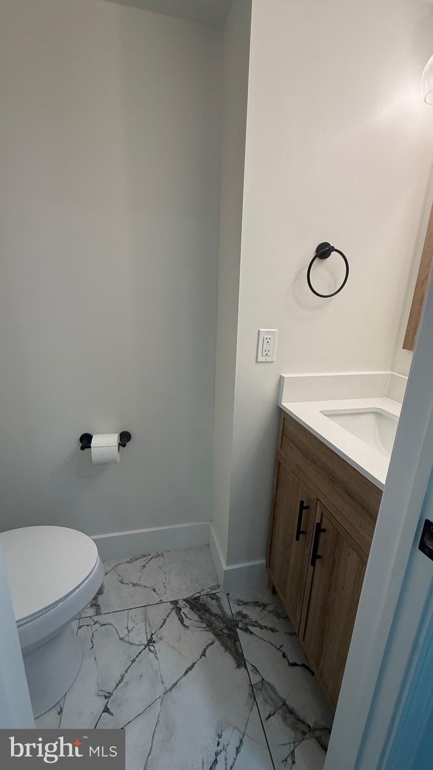 3802 Rokeby Road Baltimore, MD 21229 - Photo 6 of 16 a bathroom with a toilet and a shower