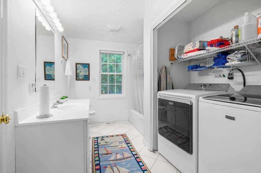 120 Queen Anne Road Harwich, MA 02645 - Photo 15 of 35 a utility room with cabinets dryer and washer