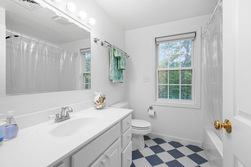 120 Queen Anne Road Harwich, MA 02645 - Photo 19 of 35 a bathroom with a sink a toilet and a mirror