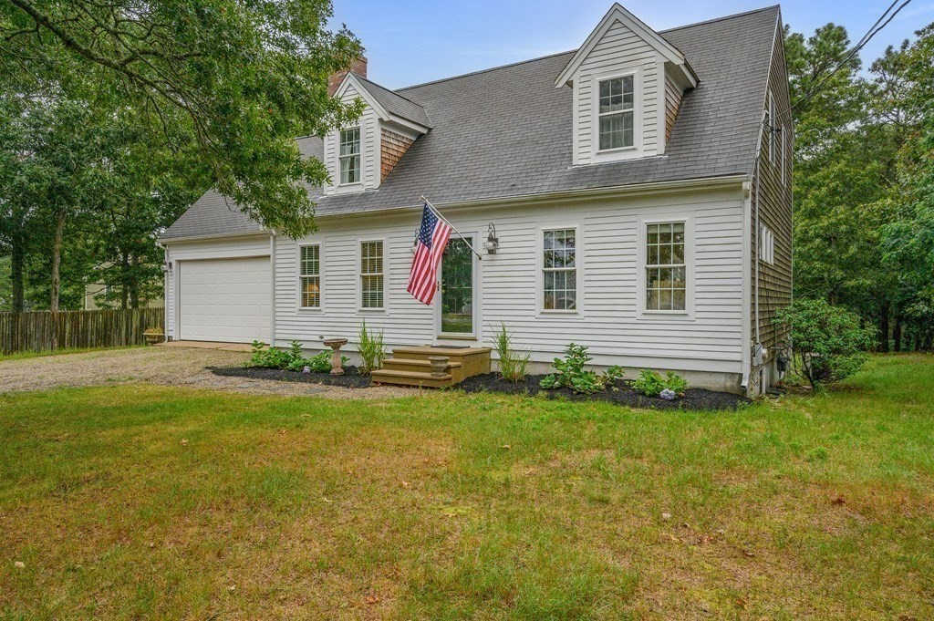 120 Queen Anne Road Harwich, MA 02645 - Photo 2 of 35 a front view of house with yard and trees