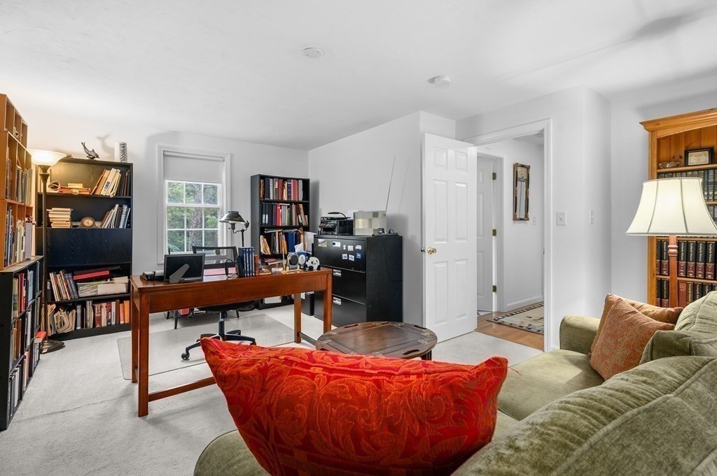 120 Queen Anne Road Harwich, MA 02645 - Photo 24 of 35 a living room with furniture and a wooden floor