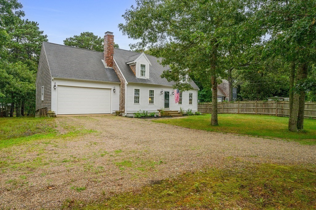 120 Queen Anne Road Harwich, MA 02645 - Photo 26 of 35 a front view of house with yard and green space