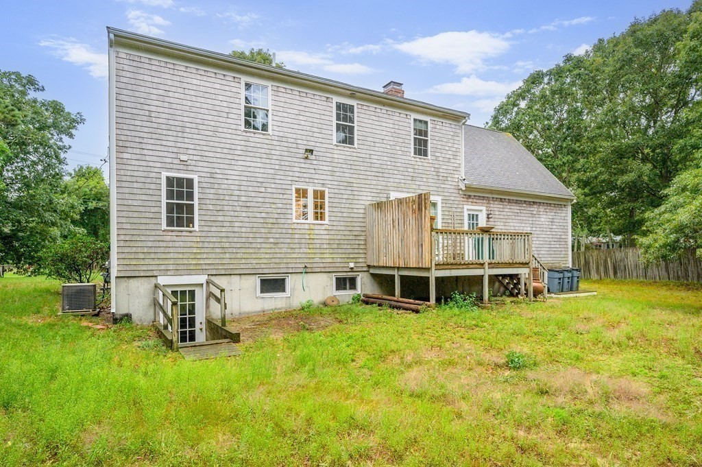120 Queen Anne Road Harwich, MA 02645 - Photo 27 of 35 a view of a house with a backyard