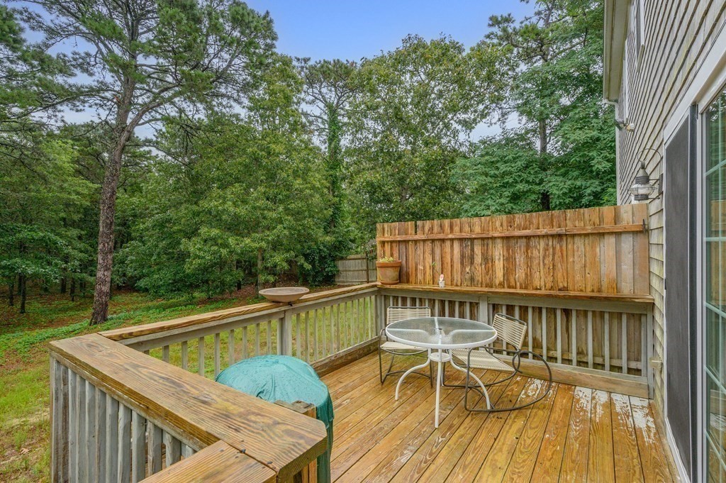 120 Queen Anne Road Harwich, MA 02645 - Photo 28 of 35 a view of a roof deck with couches and wooden floor