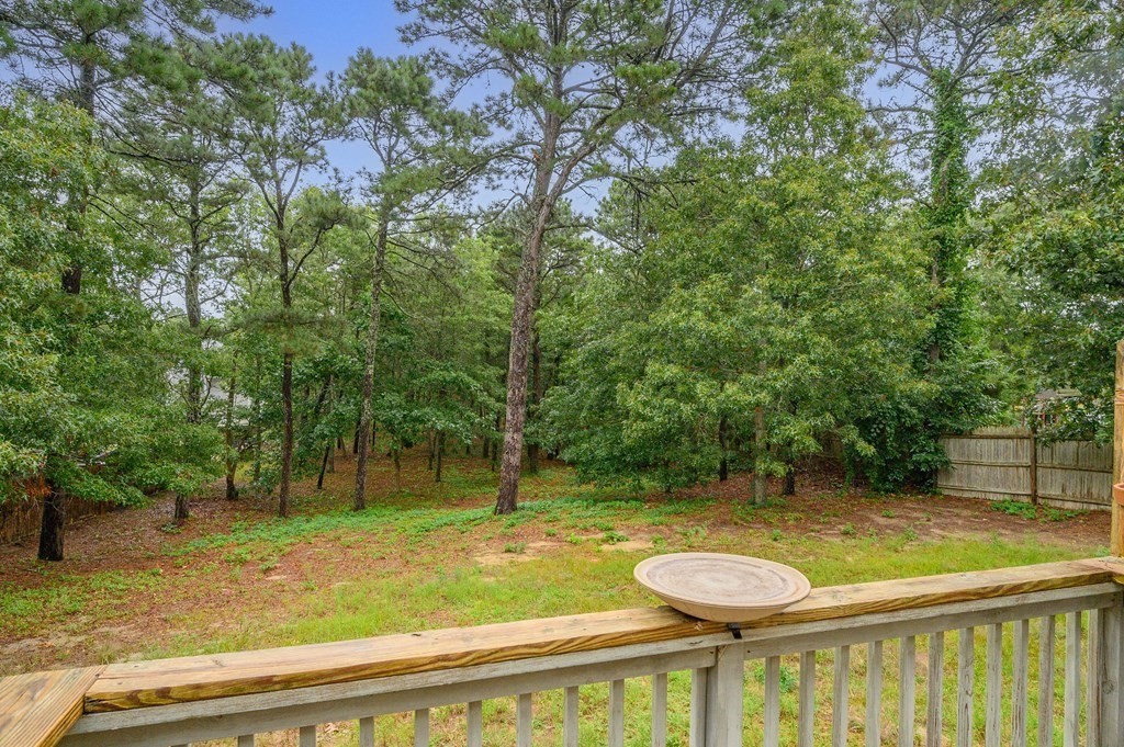 120 Queen Anne Road Harwich, MA 02645 - Photo 31 of 35 a view of a swimming pool with a patio and a yard