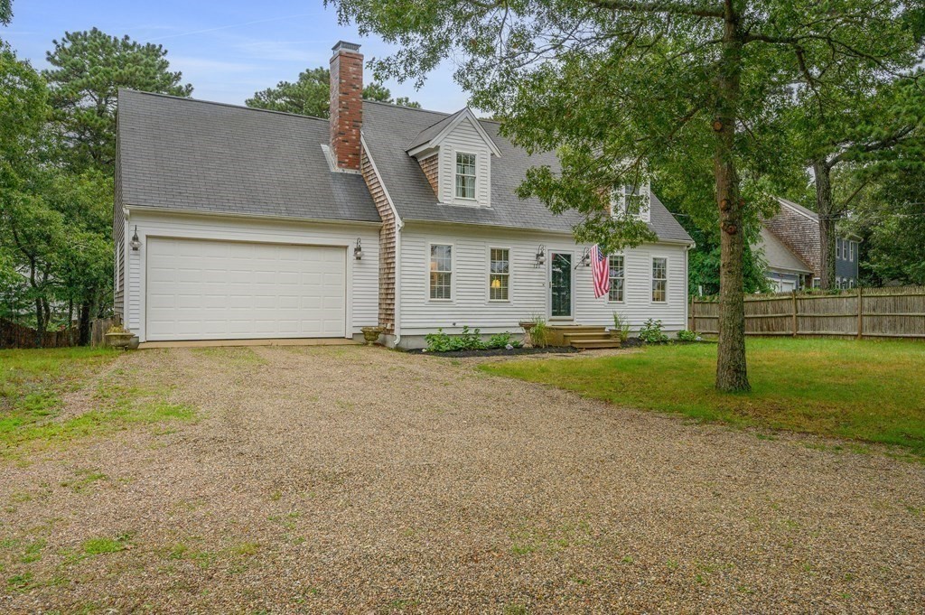 120 Queen Anne Road Harwich, MA 02645 - Photo 32 of 35 a front view of house with yard and green space