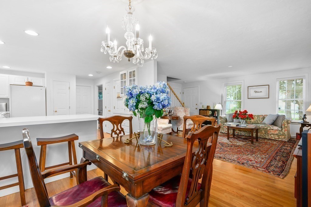 120 Queen Anne Road Harwich, MA 02645 - Photo 8 of 35 a view of a dining room with furniture and a chandelier