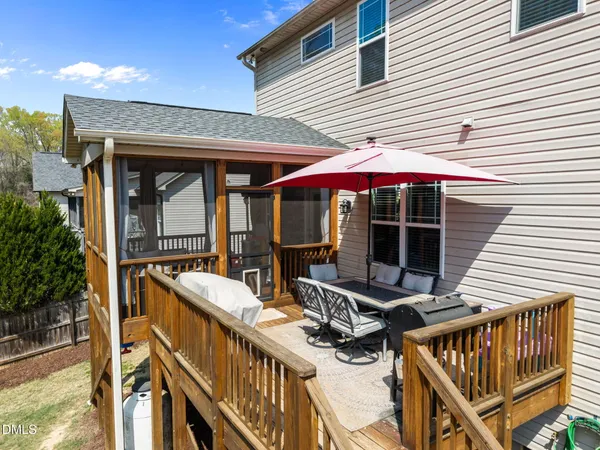 a view of a dining room with furniture and window