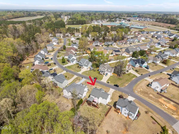 an aerial view of residential houses with outdoor space
