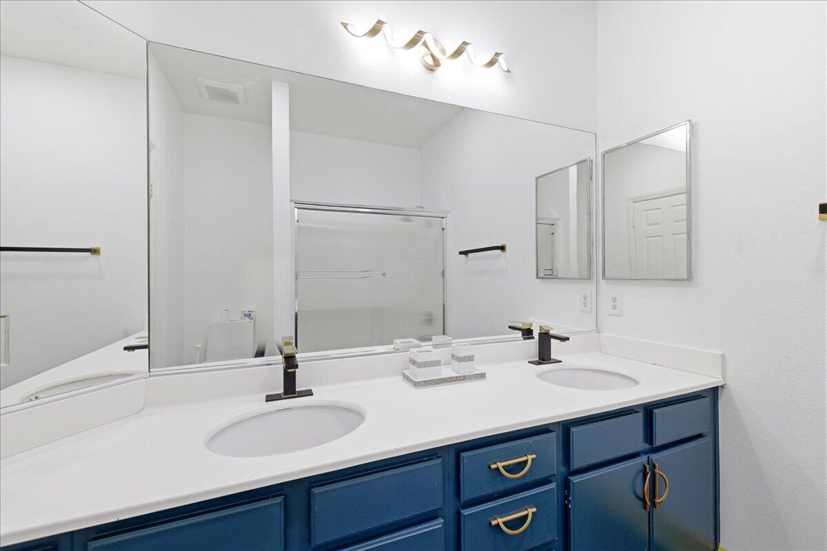 23732 Bella Vista Road Corona, CA 92883 - Photo 29 of 49 a bathroom with a sink and a mirror