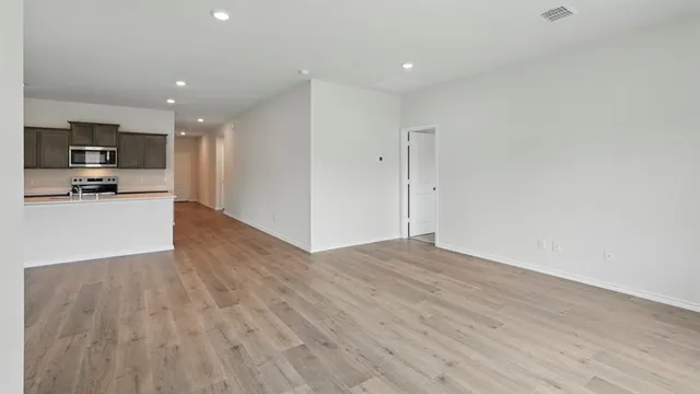 a view of kitchen with wooden floor