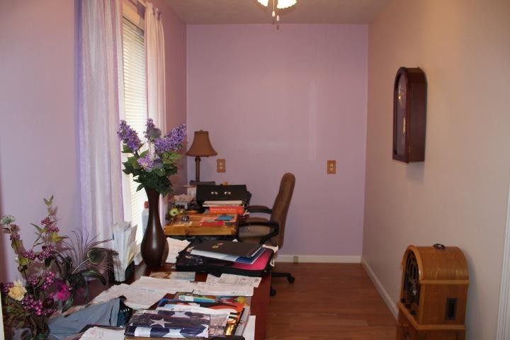 2431 South Toto Road North Judson, IN 46366 - Photo 9 of 25 a view of a workspace with furniture and a potted plant