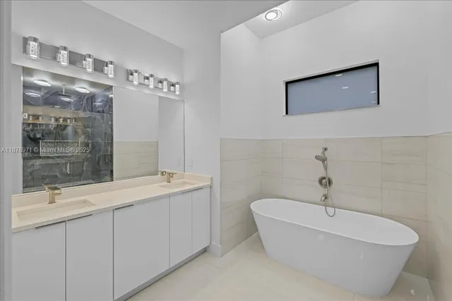 a bathroom with a bathtub and a sink