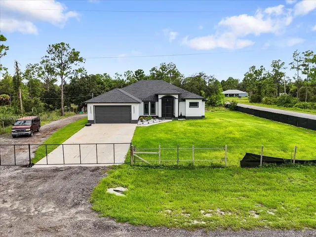 a view of a house with a yard porch and sitting area