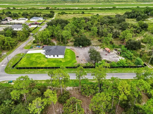 an aerial view of a houses with outdoor space