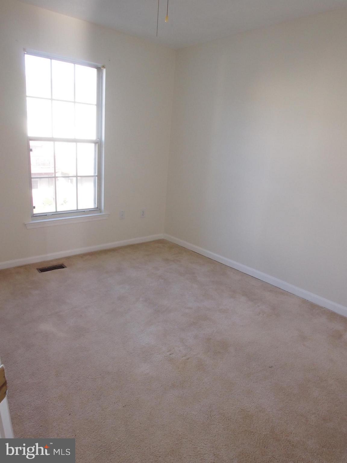 5307 Hollowstone Circle Rosedale, MD 21237 - Photo 12 of 22 an empty room with a window