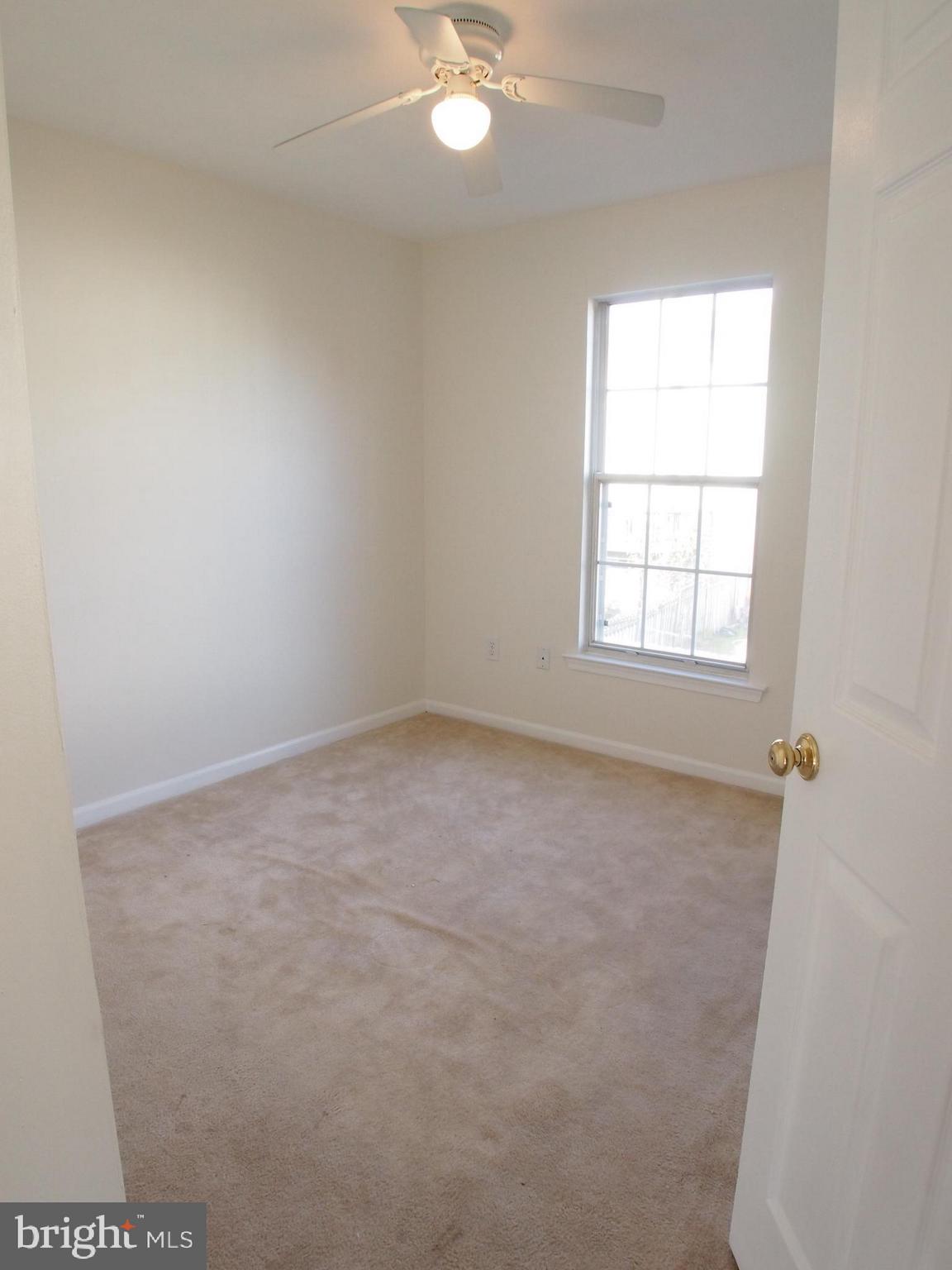 5307 Hollowstone Circle Rosedale, MD 21237 - Photo 13 of 22 an empty room with a window