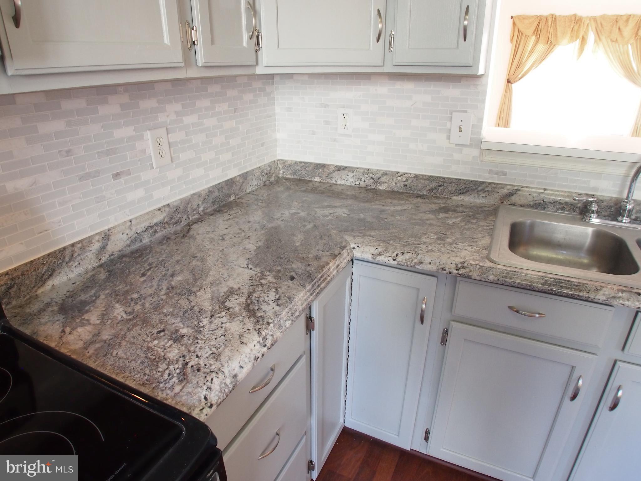 5307 Hollowstone Circle Rosedale, MD 21237 - Photo 19 of 22 a kitchen with a sink and cabinets