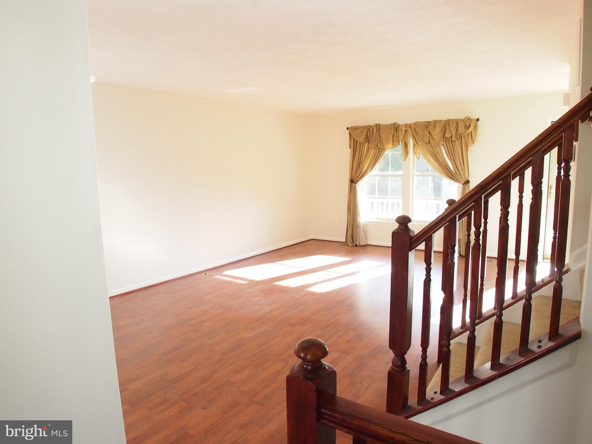 5307 Hollowstone Circle Rosedale, MD 21237 - Photo 20 of 22 a view of staircase with railing and white walls