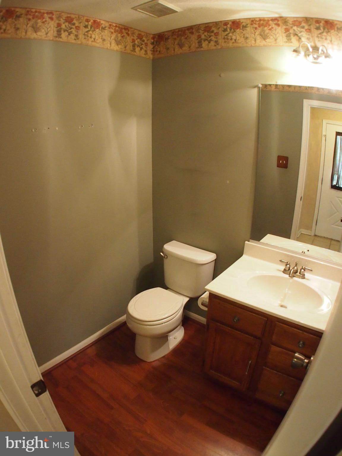 5307 Hollowstone Circle Rosedale, MD 21237 - Photo 5 of 22 a bathroom with a sink a toilet and shower
