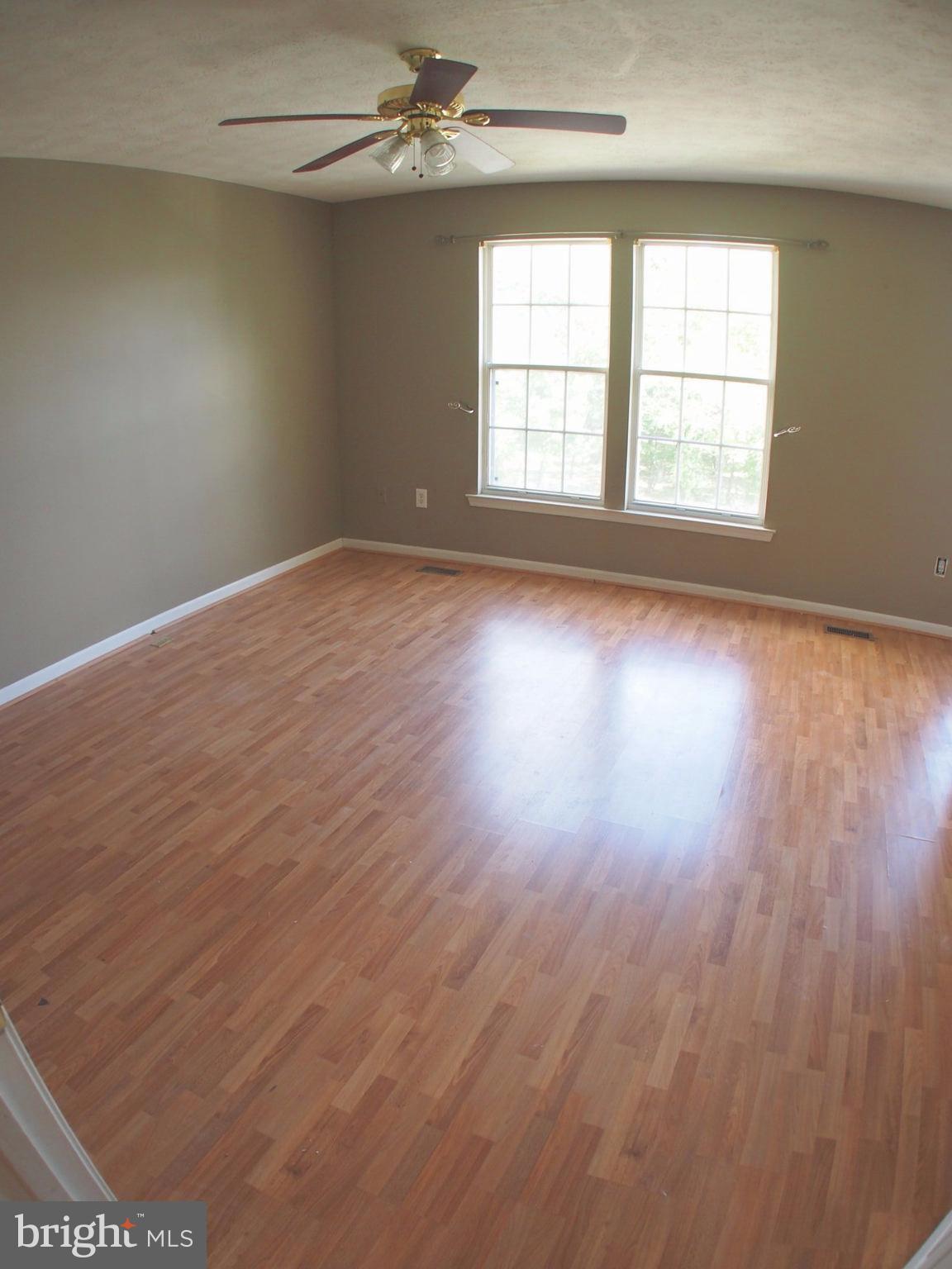 5307 Hollowstone Circle Rosedale, MD 21237 - Photo 8 of 22 wooden floor in an empty room with a window