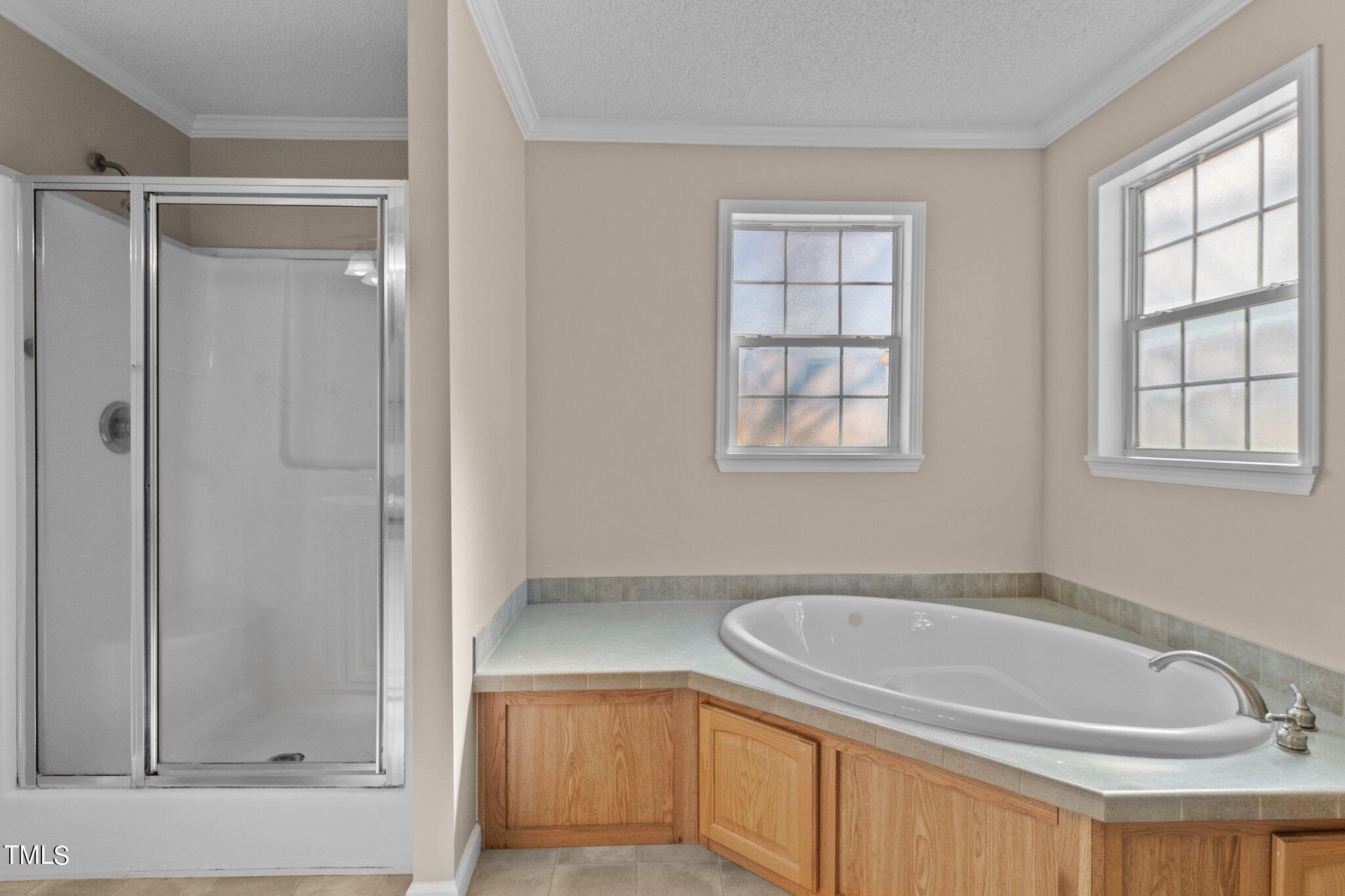7929 Keener Road Clinton, NC 28328 - Photo 18 of 36 a bathroom with a tub a sink and a window