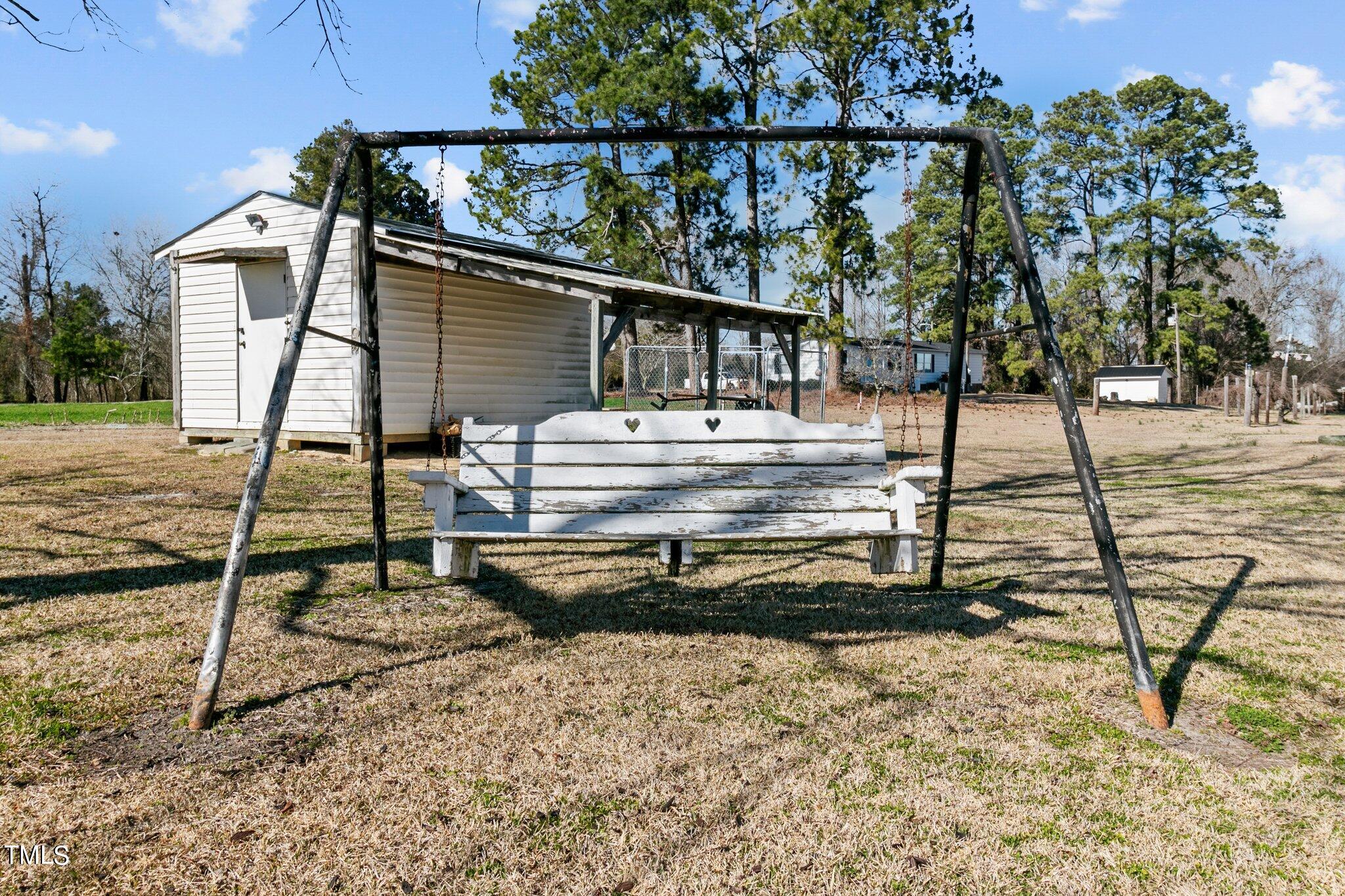 7929 Keener Road Clinton, NC 28328 - Photo 32 of 36 a view of a house with wooden deck